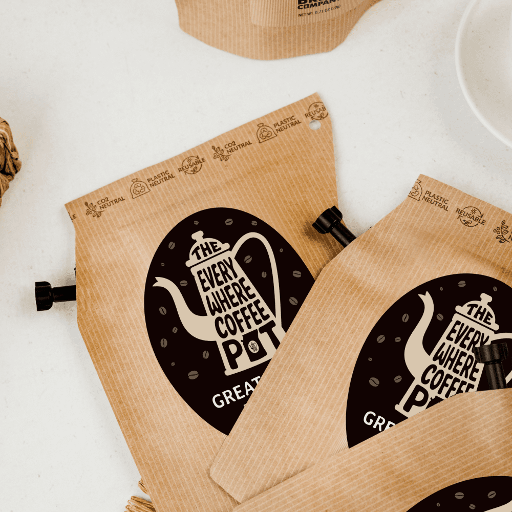 Kraft paper coffee bag with 'Everywhere Coffee Pot' logo on a white background