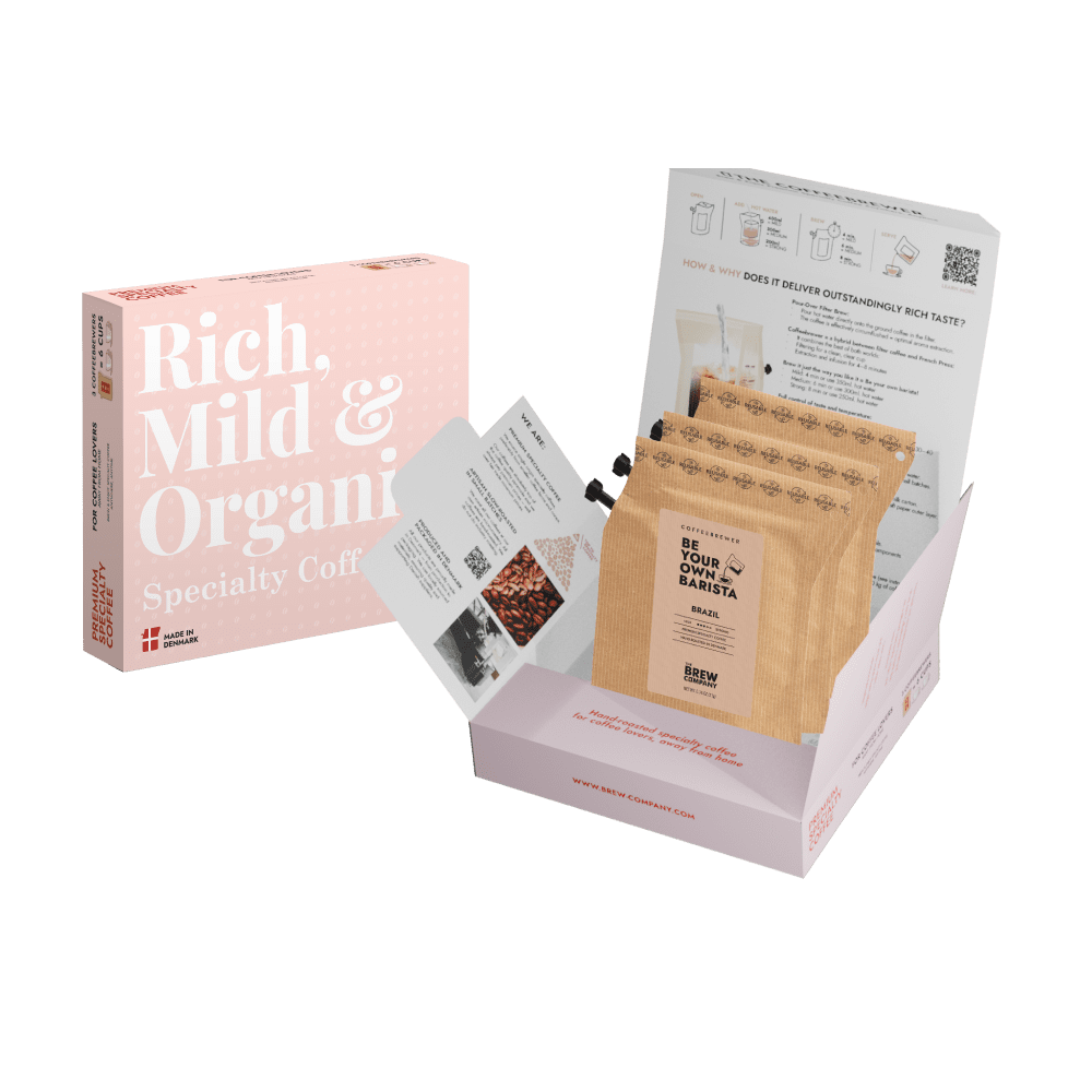 Coffee packaging with a pink box labeled 'Rich, Mild & Organic' and a cardboard sleeve with coffee bags.