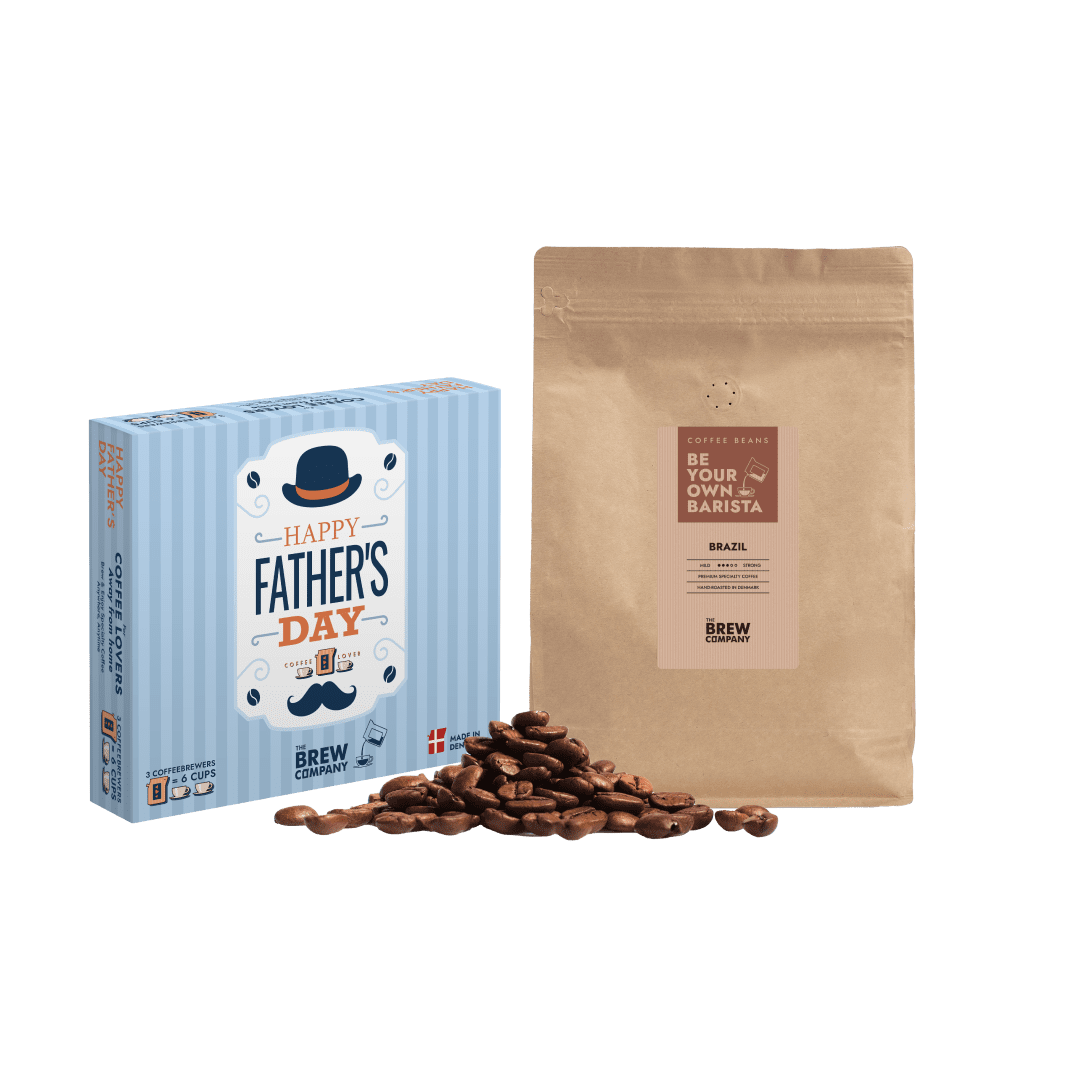 Father's Day gift set with coffee beans, coffee packaging, and a card on a green background